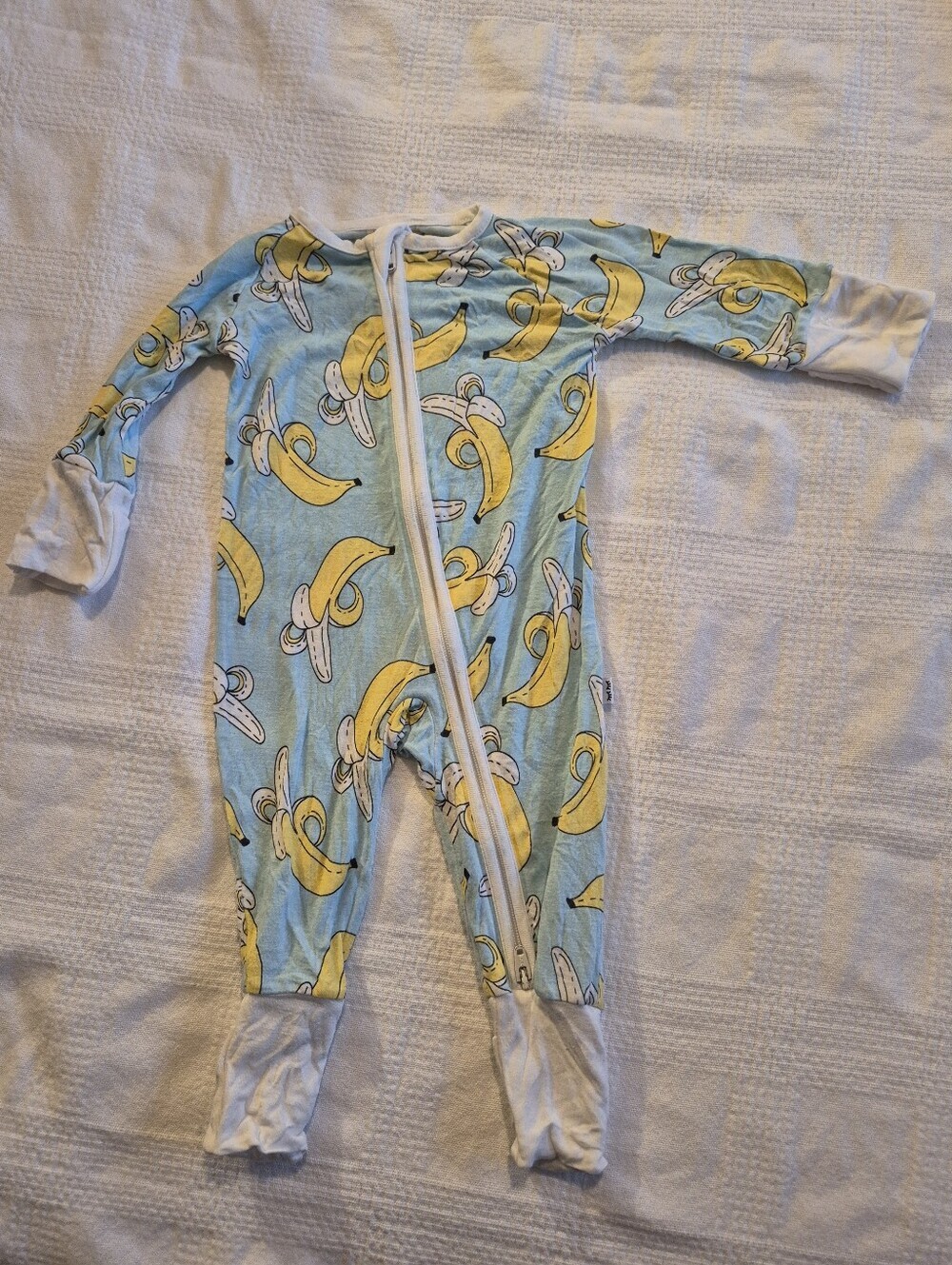 Little Sleepies Newborn light blue with Banana print have some pulls no holes